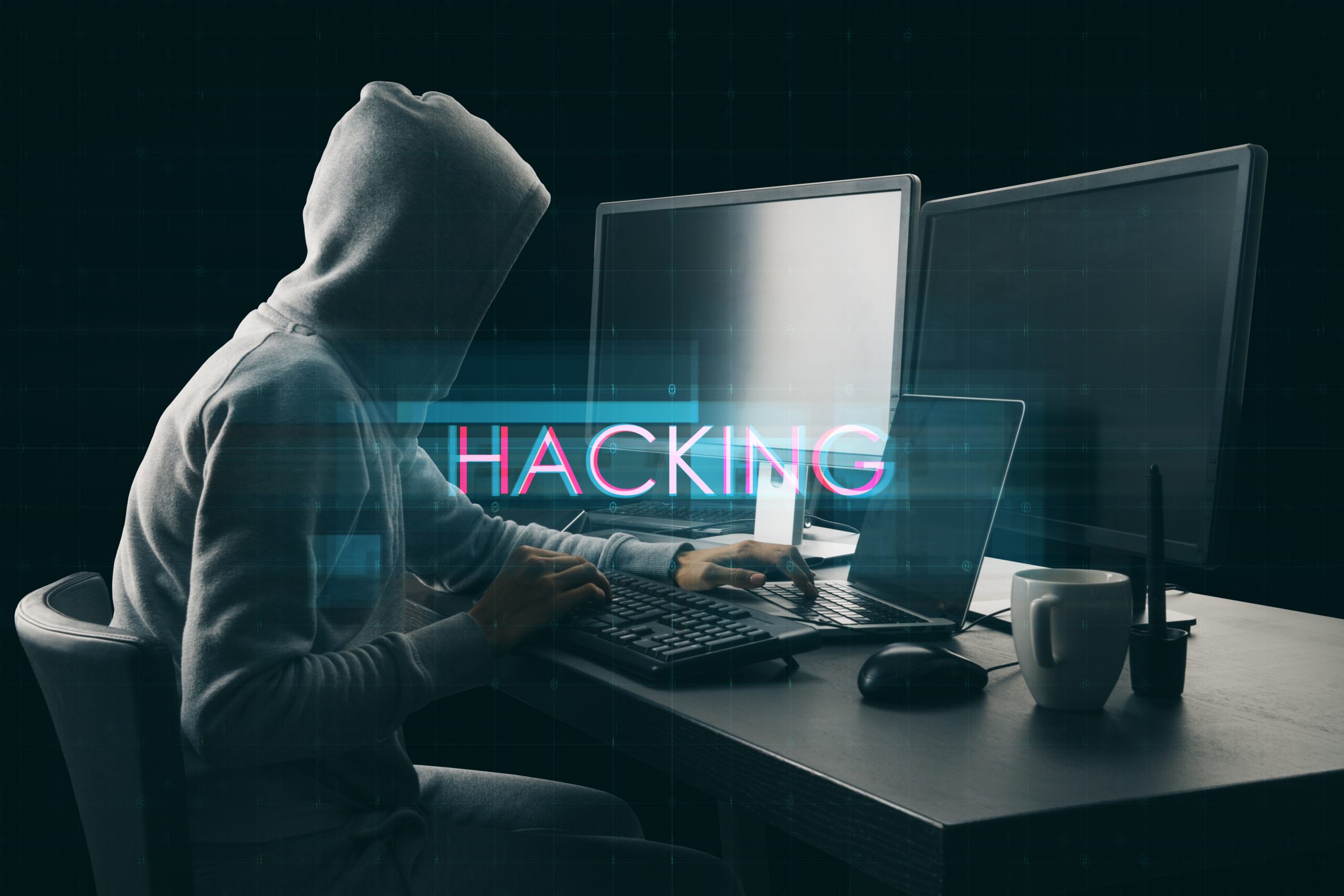 Side,View,Of,Hacker,At,Desktop,Using,Computers,With,Abstract